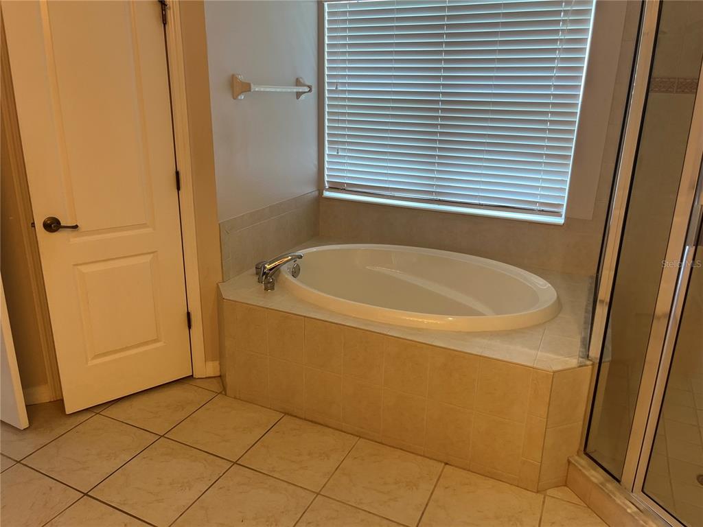 5966 Willows Bridge Loop Ellenton, FL 34222 - Photo 34 of 57 a bathroom with a tub and shower
