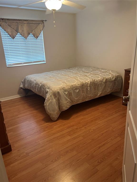 5966 Willows Bridge Loop Ellenton, FL 34222 - Photo 43 of 57 a bedroom with a bed and a night stand