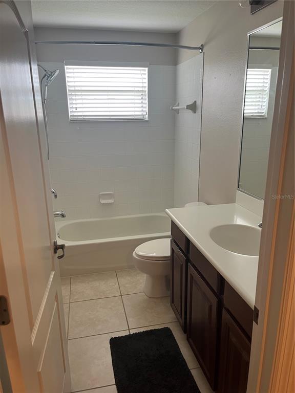 5966 Willows Bridge Loop Ellenton, FL 34222 - Photo 45 of 57 a bathroom with a granite countertop sink toilet a shower and a mirror