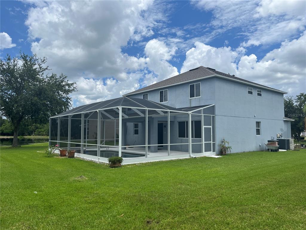 5966 Willows Bridge Loop Ellenton, FL 34222 - Photo 5 of 57 a view of a house with yard and a large tree