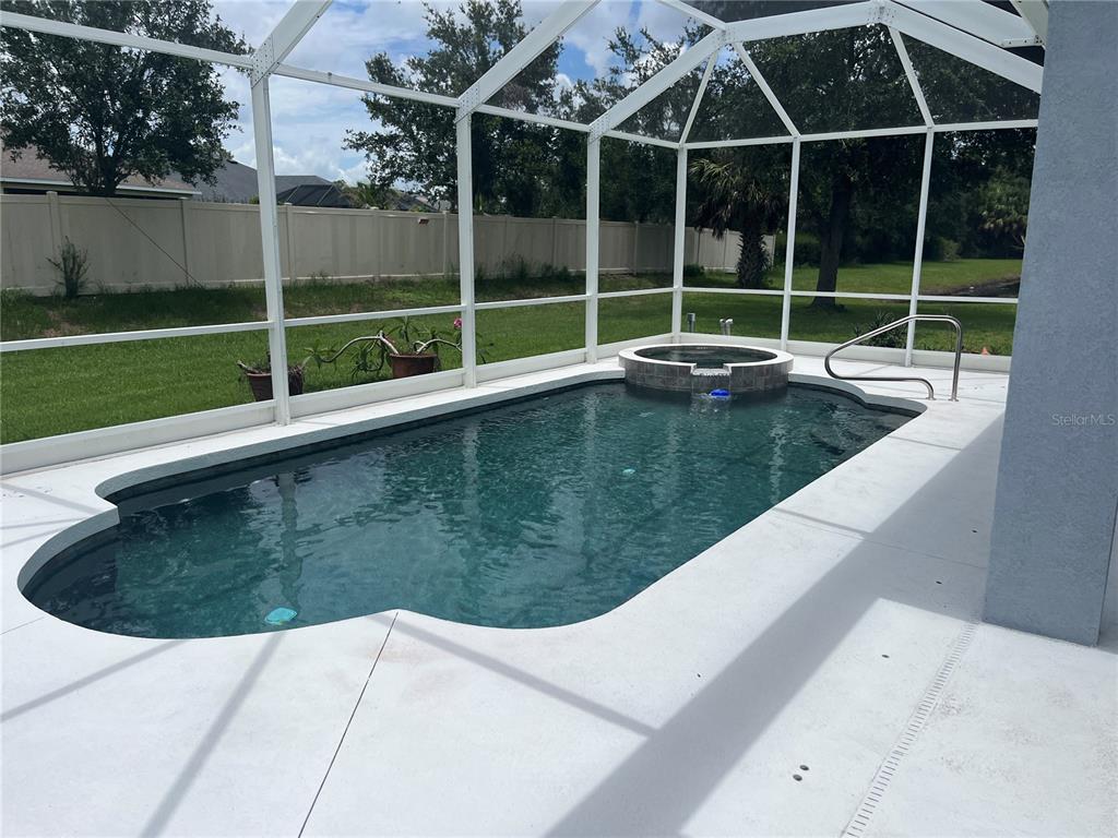 5966 Willows Bridge Loop Ellenton, FL 34222 - Photo 8 of 57 a view of a swimming pool with a backyard