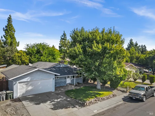 an aerial view of a house with a garden