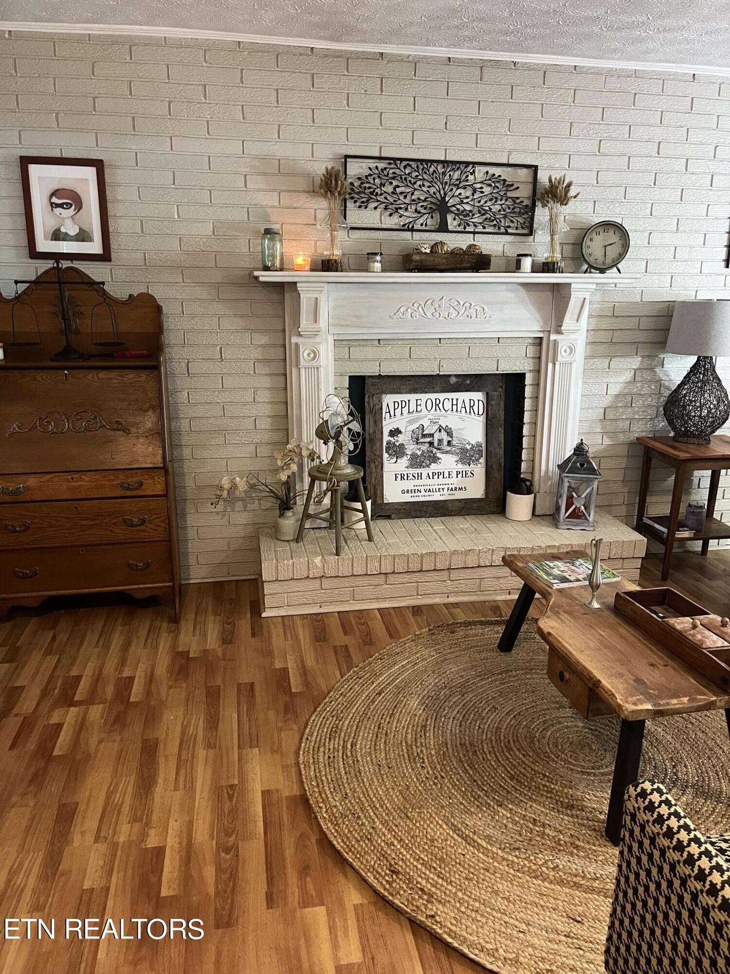 430 Foust Carney Road Powell, TN 37849 - Photo 9 of 45 a living room with furniture and a fireplace