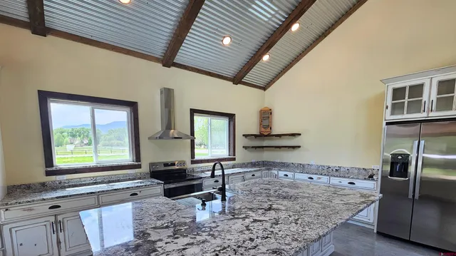 a living room filled with furniture window and a table