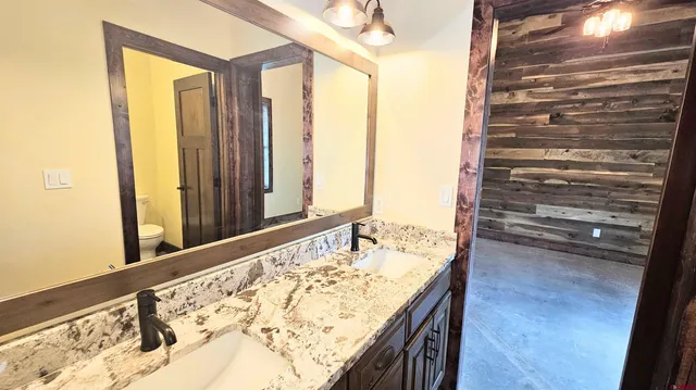 a kitchen with a sink stove and cabinets