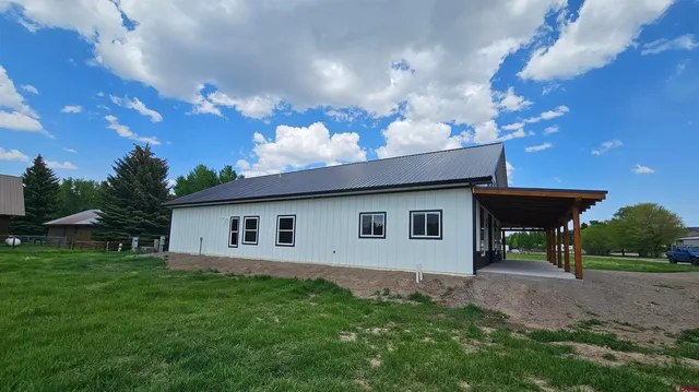 a view of a backyard with a garden