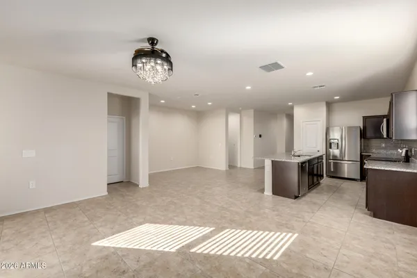 a kitchen with stainless steel appliances granite countertop a sink and a stove