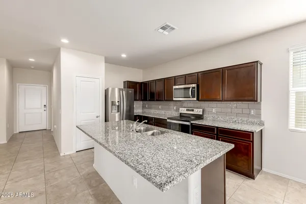 a kitchen with a stove and a microwave