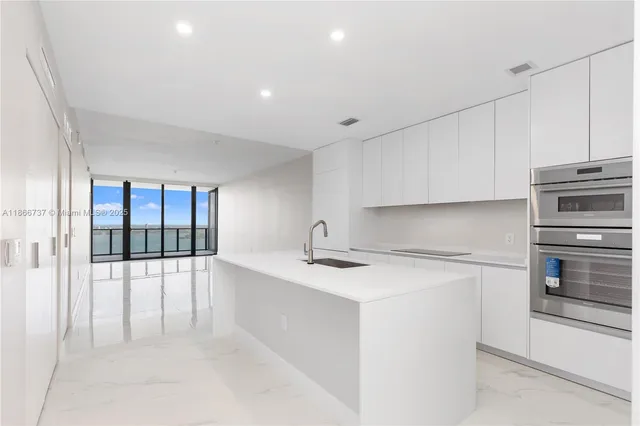 a view of an empty room with sliding glass door