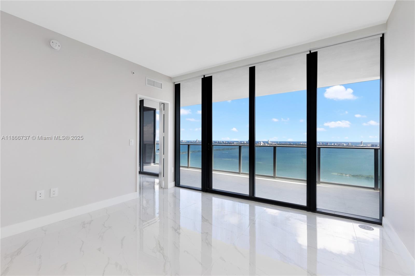 700 Northeast 24th Street, Unit 4206 Miami, FL 33137 - Photo 16 of 79 a view of an empty room with glass door and glass door