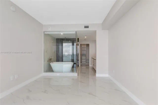 a view of an empty walk in closet