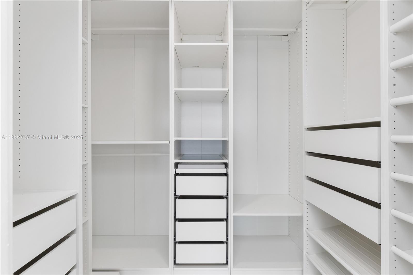 700 Northeast 24th Street, Unit 4206 Miami, FL 33137 - Photo 24 of 79 a view of walk in closet with empty racks