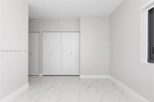 a lobby with furniture and flowers