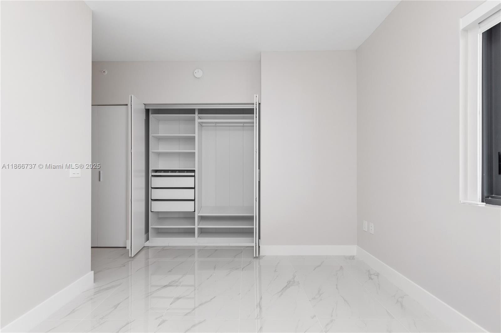 700 Northeast 24th Street, Unit 4206 Miami, FL 33137 - Photo 29 of 79 a view of an empty walk in closet