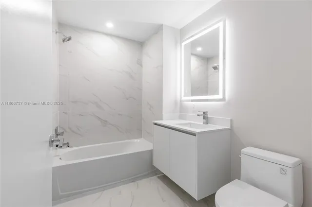 a balcony with furniture and a potted plant