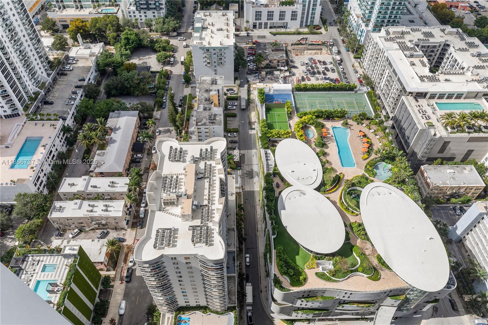 700 Northeast 24th Street, Unit 4206 Miami, FL 33137 - Photo 37 of 79 a aerial view of multiple house with outdoor seating