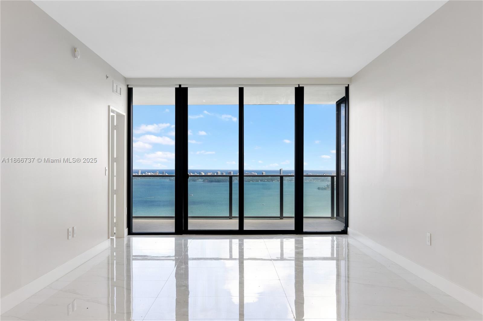 700 Northeast 24th Street, Unit 4206 Miami, FL 33137 - Photo 4 of 79 a view of an empty room and window