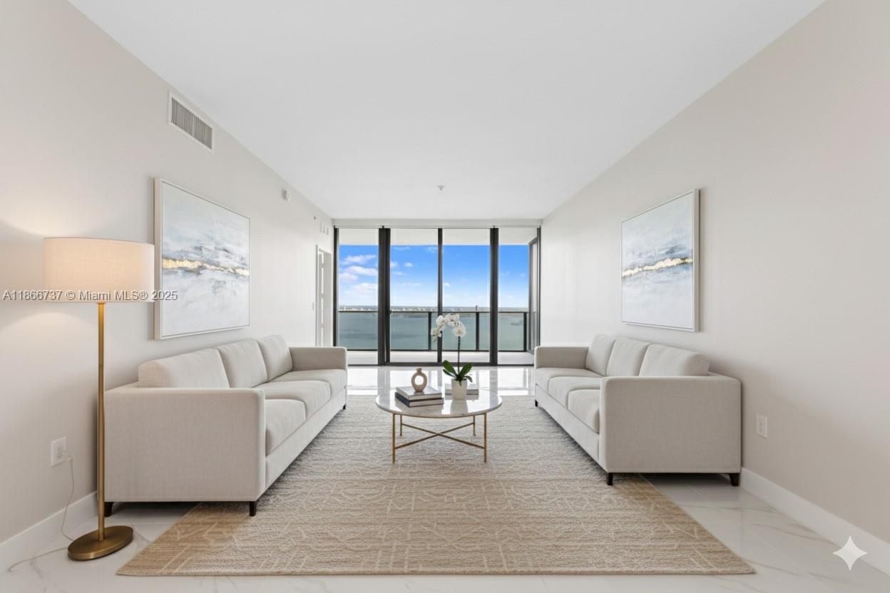 700 Northeast 24th Street, Unit 4206 Miami, FL 33137 - Photo 5 of 79 a living room with furniture and a large window