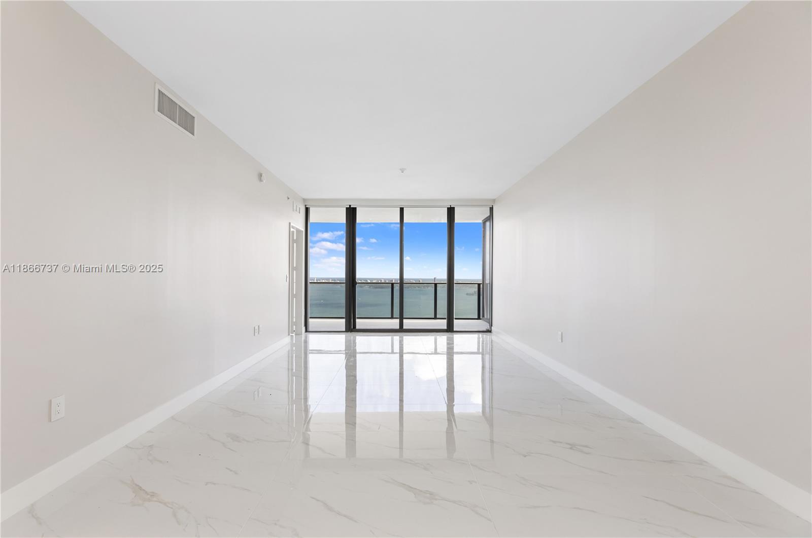 700 Northeast 24th Street, Unit 4206 Miami, FL 33137 - Photo 6 of 79 wooden floor in an empty room with a window