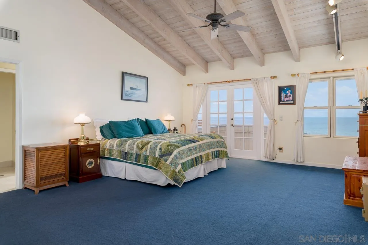 1295 Sunset Cliffs Boulevard San Diego, CA 92107 - Photo 16 of 32 a bedroom with a bed and a cabinets