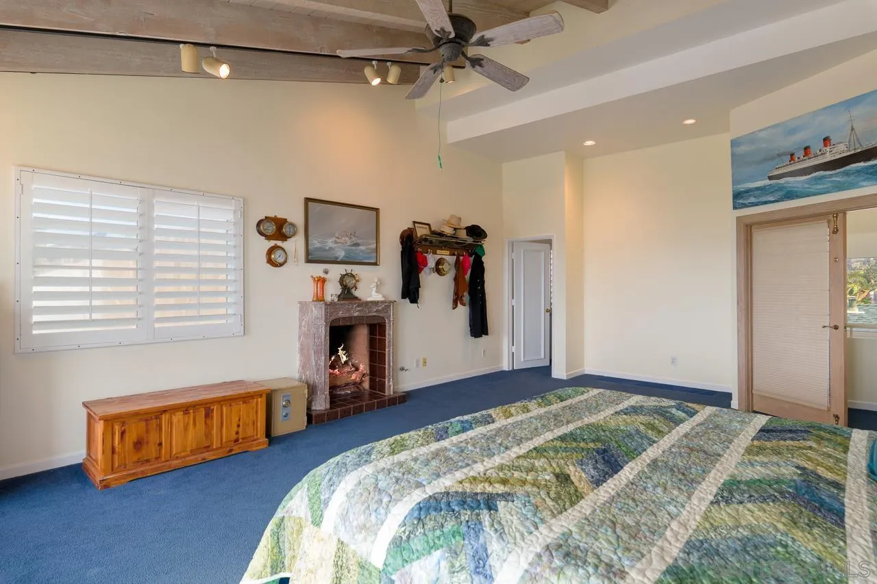 1295 Sunset Cliffs Boulevard San Diego, CA 92107 - Photo 18 of 32 a bedroom with bed and a window