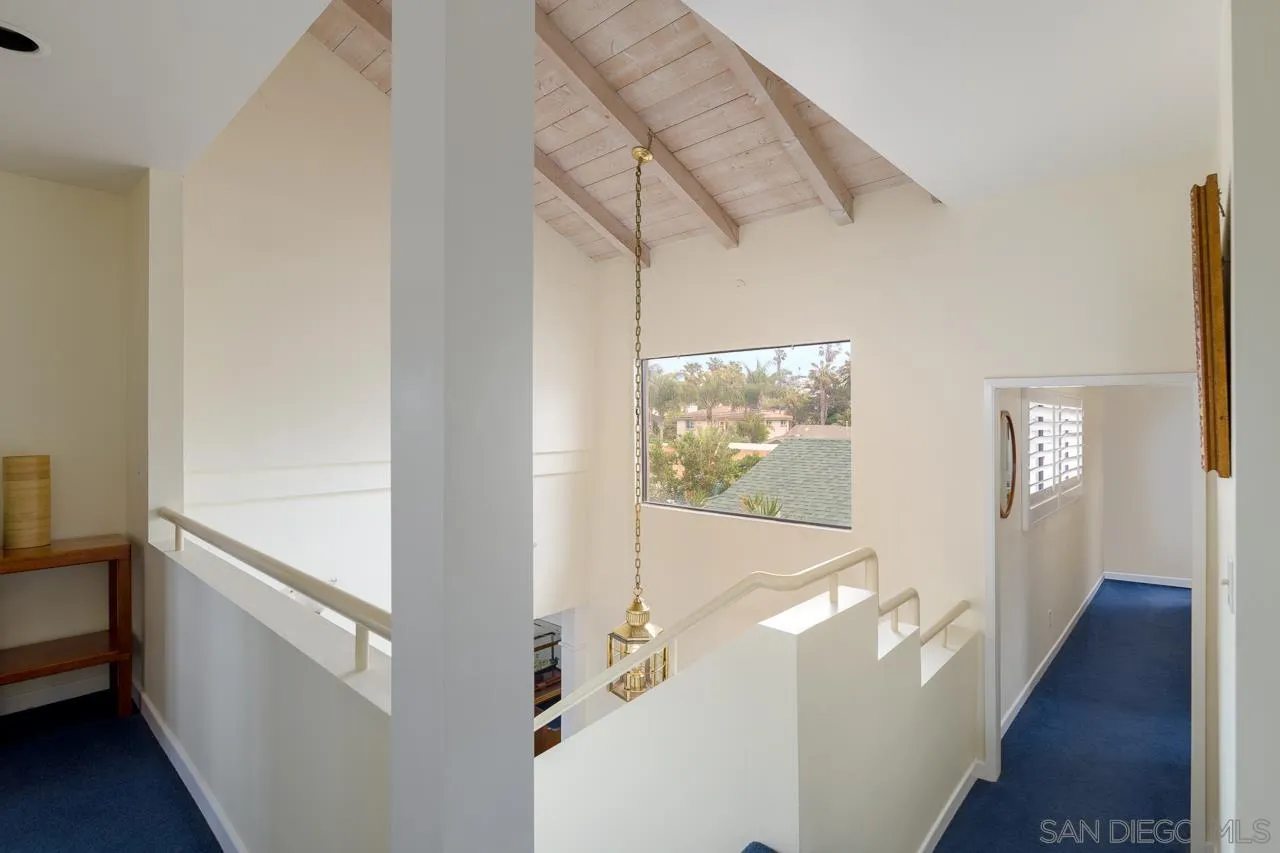 1295 Sunset Cliffs Boulevard San Diego, CA 92107 - Photo 19 of 32 a view of a hallway with wooden floor and entryway
