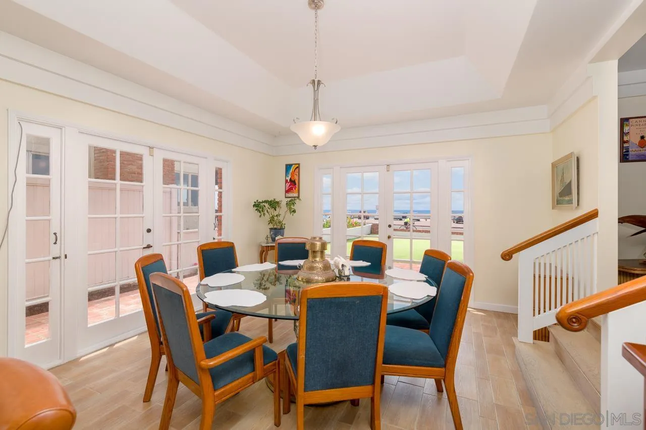1295 Sunset Cliffs Boulevard San Diego, CA 92107 - Photo 28 of 32 a view of a dining room with furniture window and wooden floor