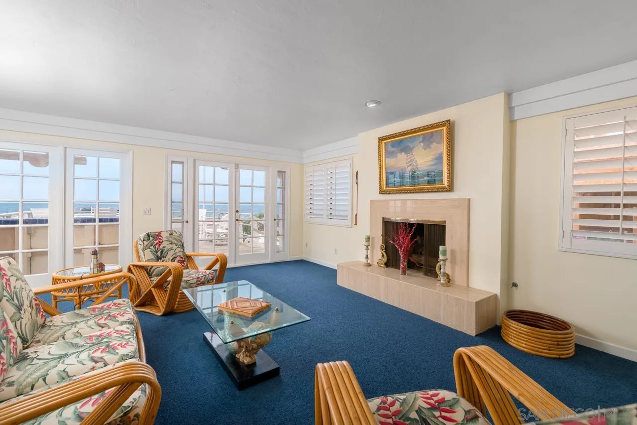 1295 Sunset Cliffs Boulevard San Diego, CA 92107 - Photo 8 of 32 a living room with furniture and a fireplace