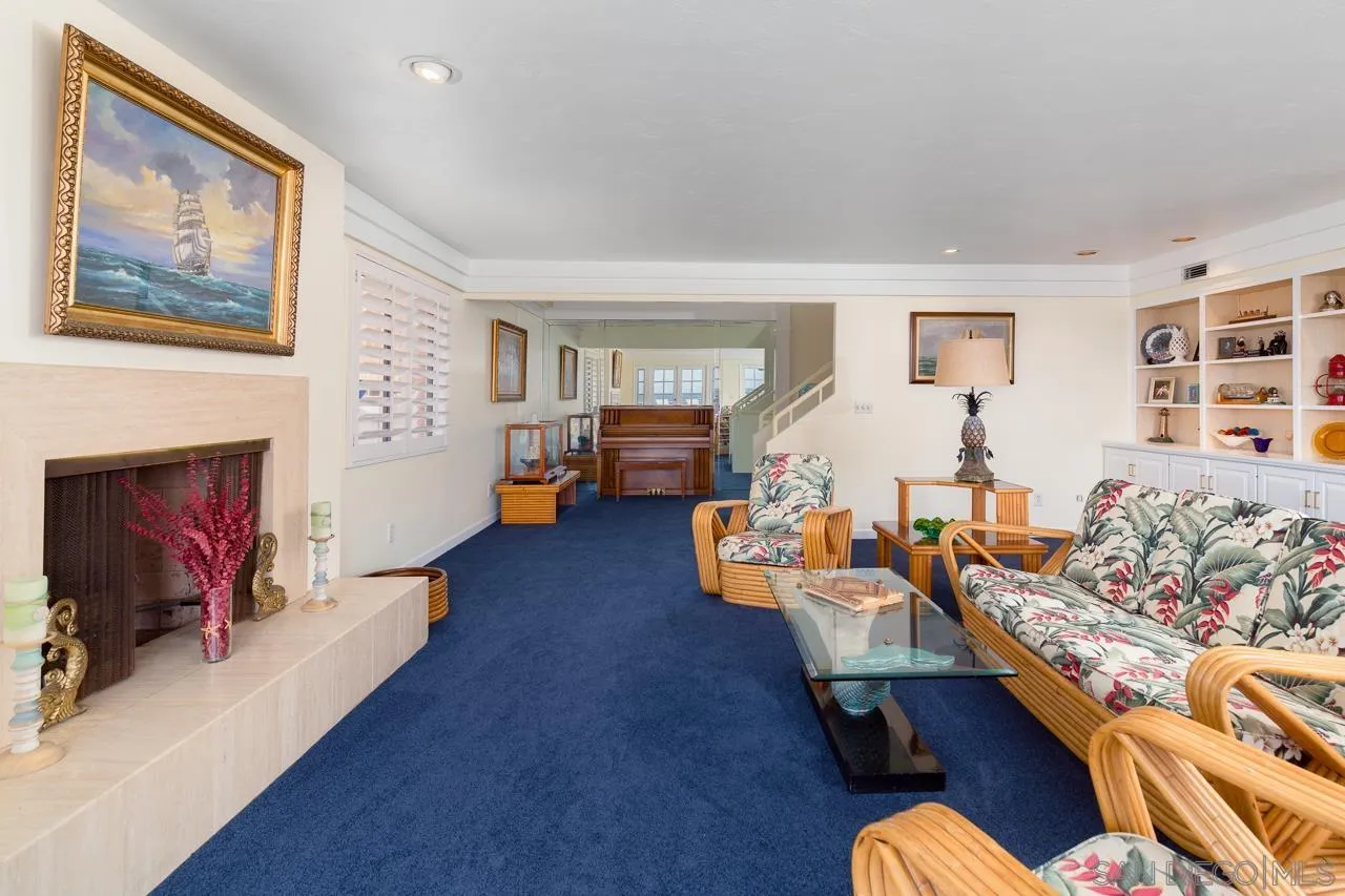 1295 Sunset Cliffs Boulevard San Diego, CA 92107 - Photo 9 of 32 a living room with furniture and a fireplace