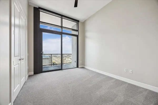 a view of an empty room with a window