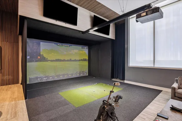 a room with pool table and a floor to ceiling window