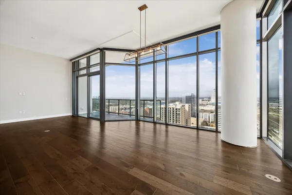 a view of an entryway with wooden floor