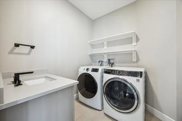 a utility room with dryer and washer