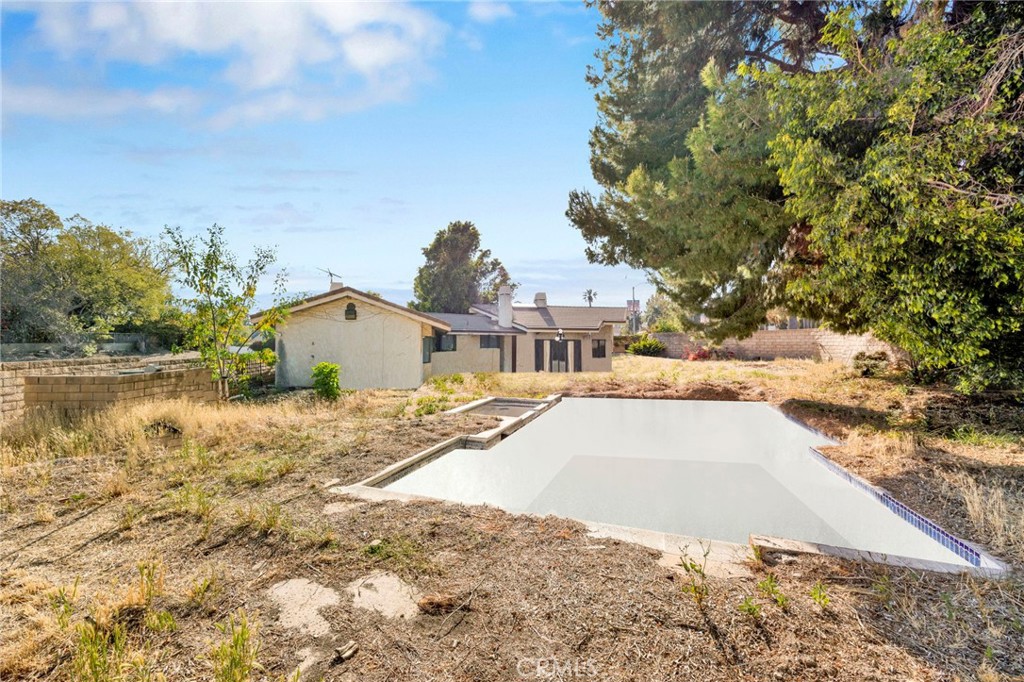 3680 Alamo Street Simi Valley, CA 93063 - Photo 15 of 19 a view of a house with a yard and covered with snow