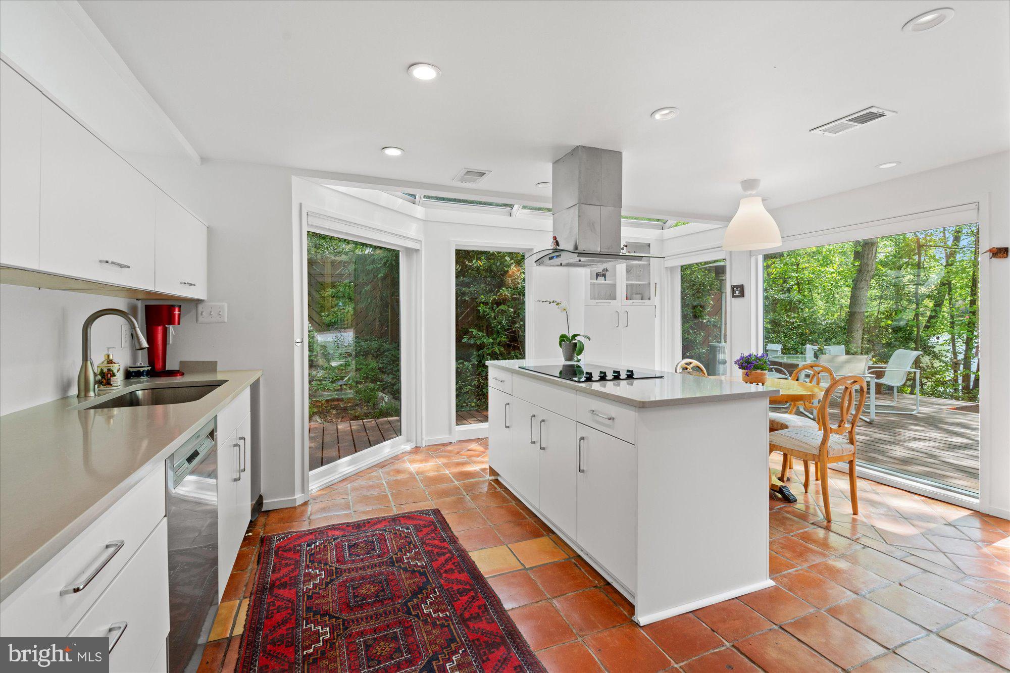 2002 Cutwater Court Reston, VA 20191 - Photo 25 of 91 Center island with cooktop and range hood