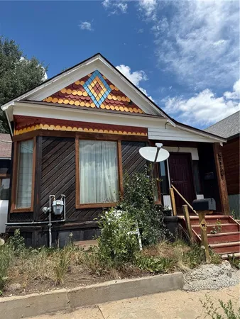 front view of a house with a car park