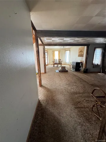 a view of a livingroom with furniture and a fireplace