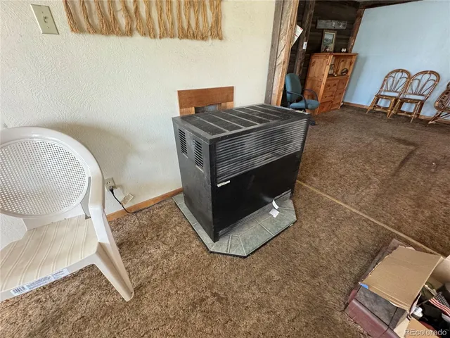 a view of a dining room with furniture and window