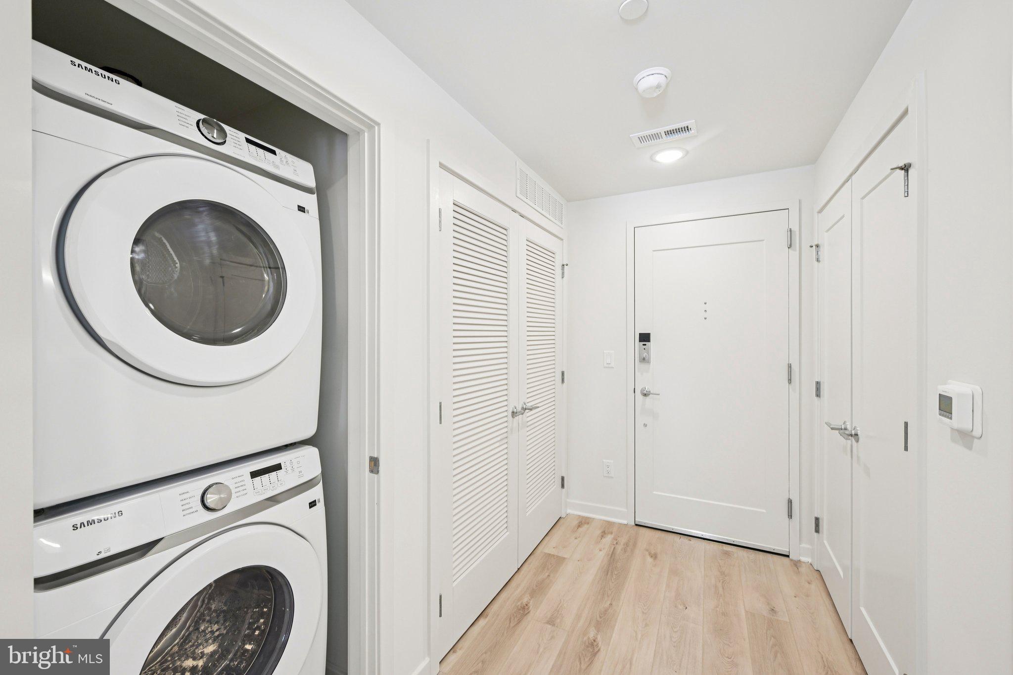 23 Rock Hill Road, Unit 201 Bala Cynwyd, PA 19004 - Photo 4 of 8 a view of a hallway with washer and dryer