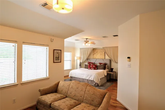 a bedroom with a bed and window