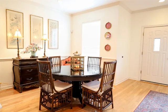 a view of a dining room with furniture and a window