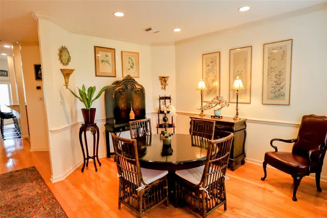 a view of a dining room with furniture and chandelier