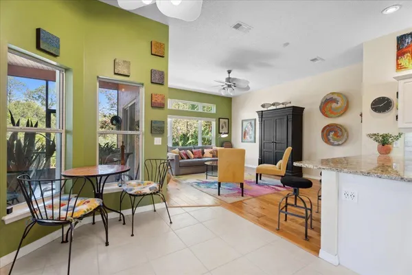 a living room with patio furniture and a window