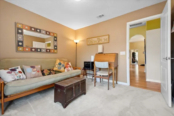 a bedroom with furniture and a couch