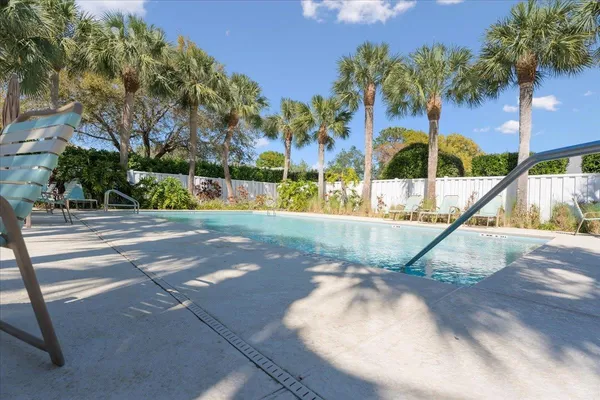 a view of a swimming pool with a garden