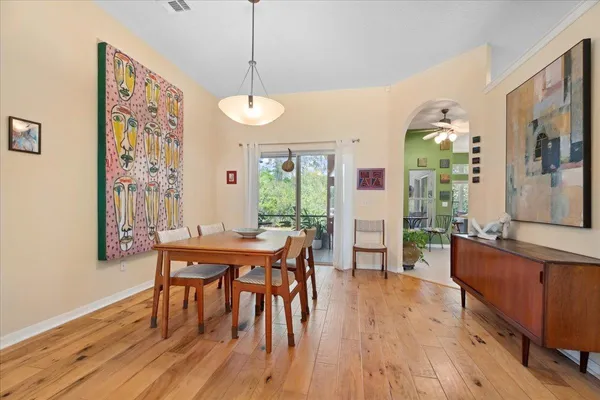 a view of a dining room with furniture window and wooden floor