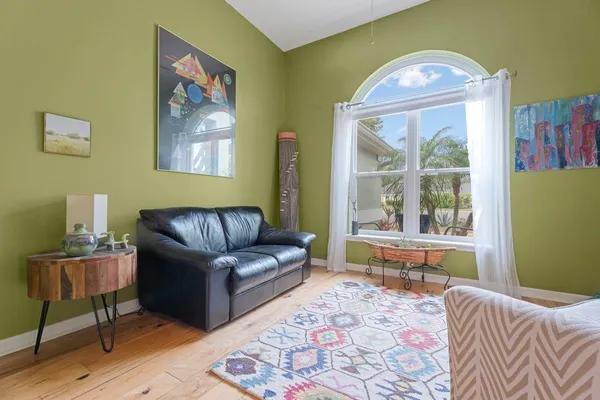 a living room with furniture and a large window
