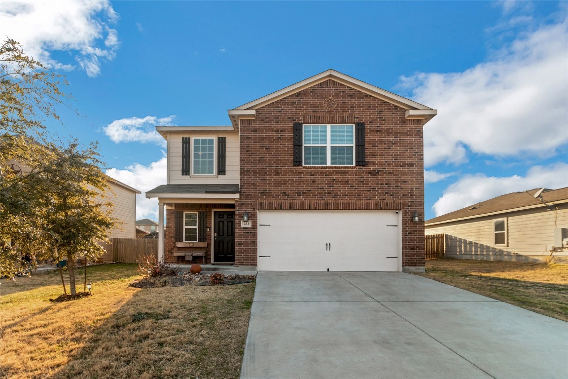 233 Millers Loop Jarrell, TX 76537 - Photo 1 of 1 a front view of a house with a yard