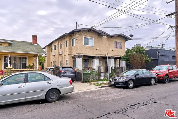 a front view of a house with parking space