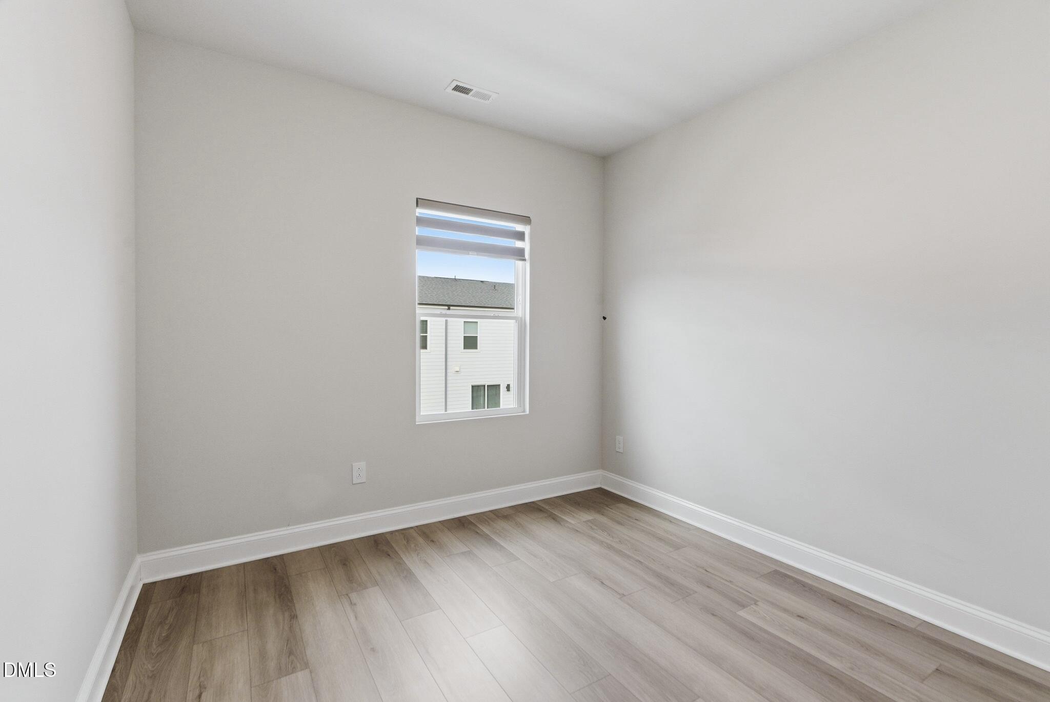501 Hedrick Ridge Road Cary, NC 27519 - Photo 31 of 47 a view of a room that has wooden floor and window